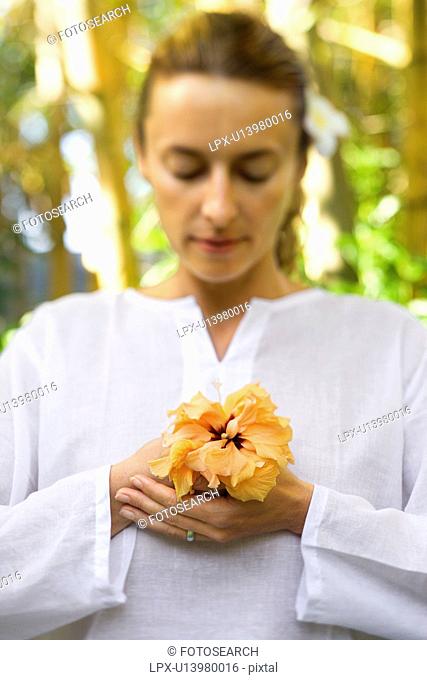 Attractive Woman Holding Flower