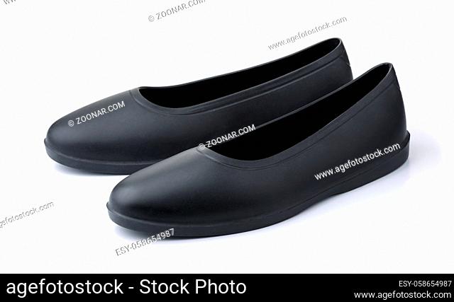 Pair of black rubber overshoe waterproof galoshes isolated on white