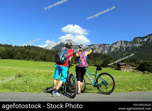 Mountain bikers enjoy the panorama from Wilder Kaiser, Austria