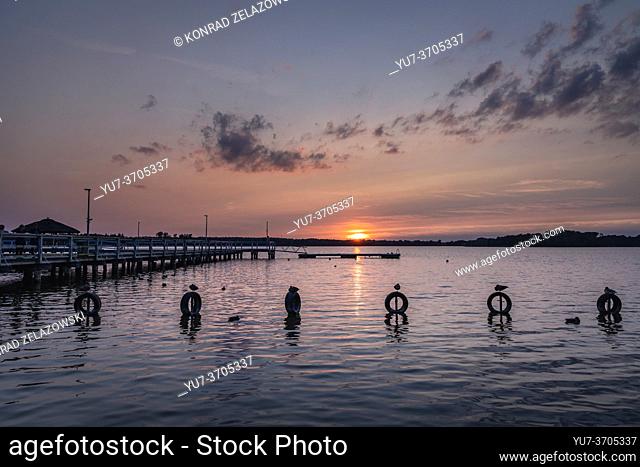 Sunset over Narie Lake located in Ilawa Lakeland region, view from Kretowiny village, Ostroda County, Warmia and Mazury province of Poland