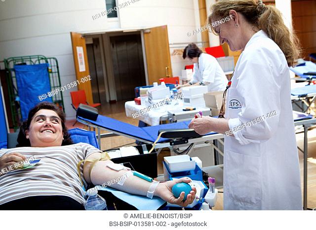 Reportage in a mobile blood donation unit run by EFS (the French Blood Establishment) in Puteaux, France. A team of nurses collect blood