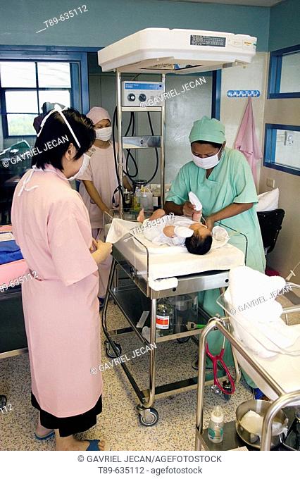 A nurse and doctor cares for a newborn in a Khon Kaen hospital