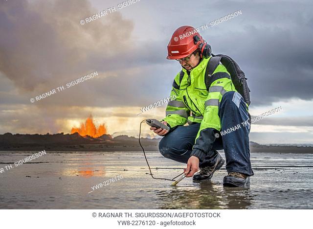 Scientist taking measurements by the eruption site at Holuhraun, near Bardabunga Volcano, Iceland