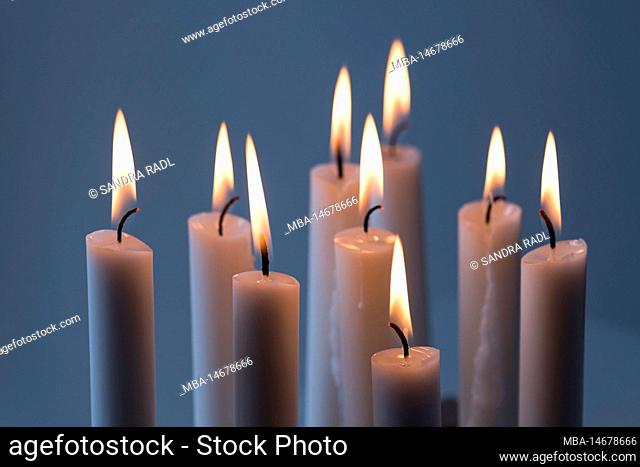 burning candles, bluish background