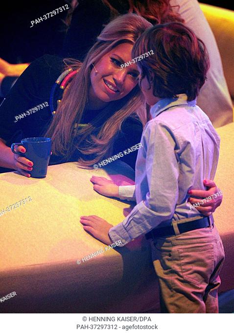 Presenter Sylvie van der Vaart stands is pictured with her son Damian during the recording of the RTL television show ""Shooting Stars - Promis an ihren...