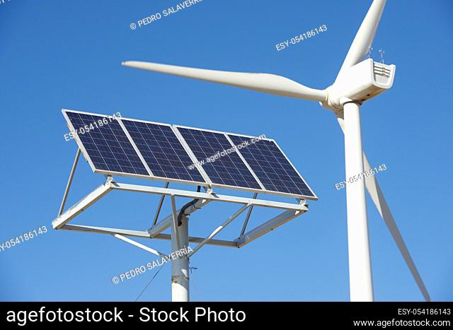 Windmill and photovoltaic panel for energy production, Zaragoza Province, Aragon, Spain