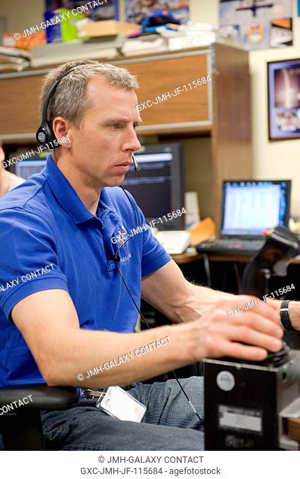 NASA astronaut Andrew Feustel, STS-134 mission specialist, uses the virtual reality lab in the Space Vehicle Mock-up Facility at NASA's Johnson Space Center to...