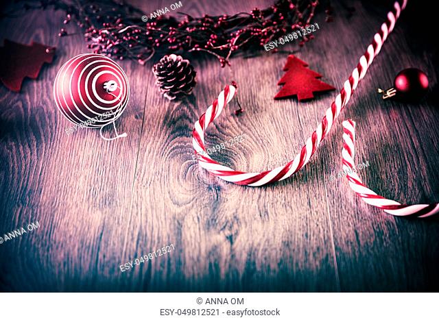Vintage Christmas background, beautiful Christmastime decorations on wooden background, traditional red and white toys, copy space for text