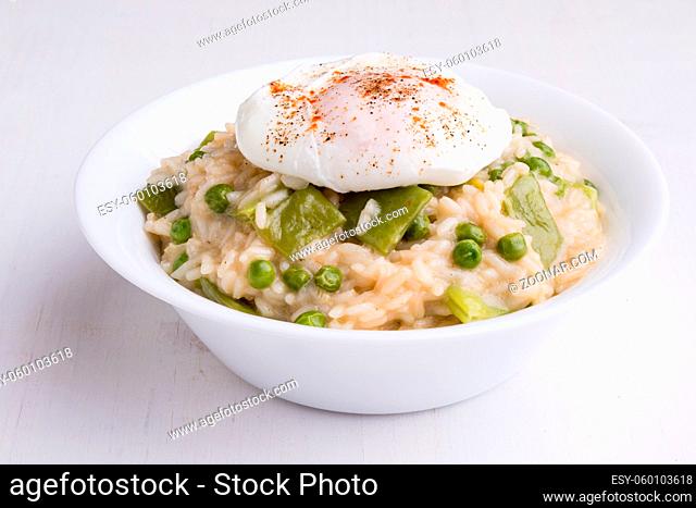 fresh vegetarian pea risotto with poached egg