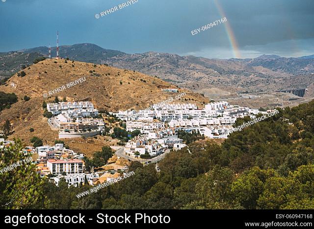Malaga, Spain. Cityscape aerial view of residential district. residential houses. real estate. Altered Sky With Rainbow
