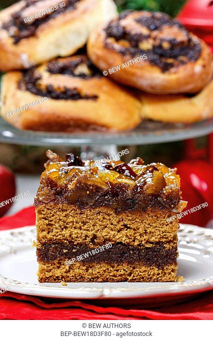 Layer cake decorated with dried fruits and honey. Party dessert