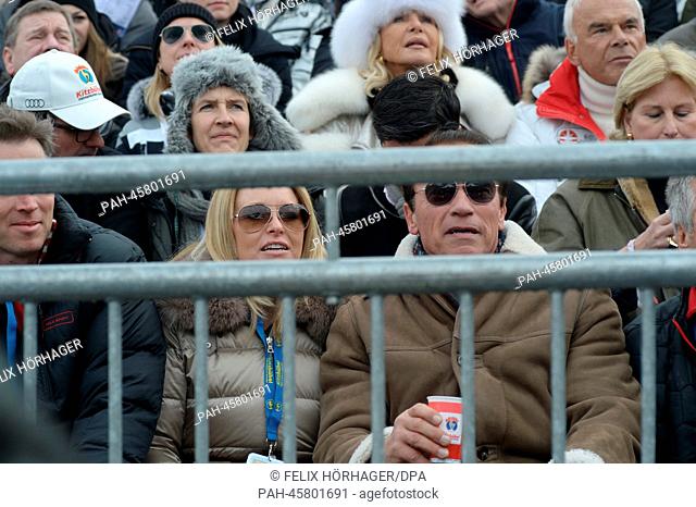Former US governor and Hollywood actor Arnold Schwarzenegger and his girlfriend Heather Milligan watch the annual Austrian downhill ski race Hahnenkamm race in...