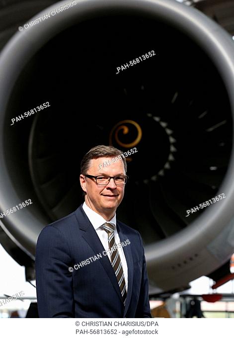 The chairman of Lufthansa Technik AG, Johannes Bussmann, stands during the balance press conference of the company in front of an aircraft engine of the Airbus...