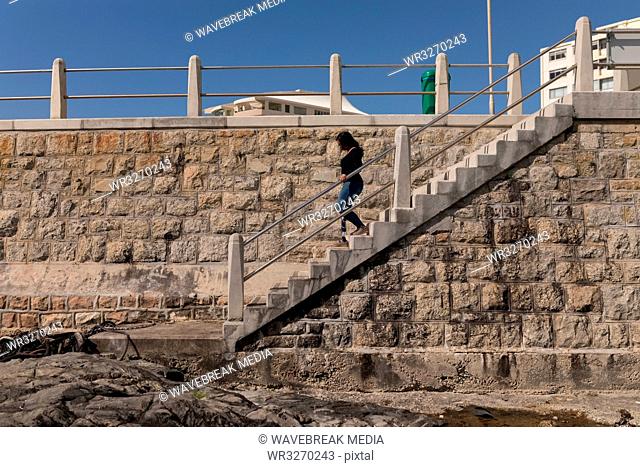 Disabled woman walking on stairs
