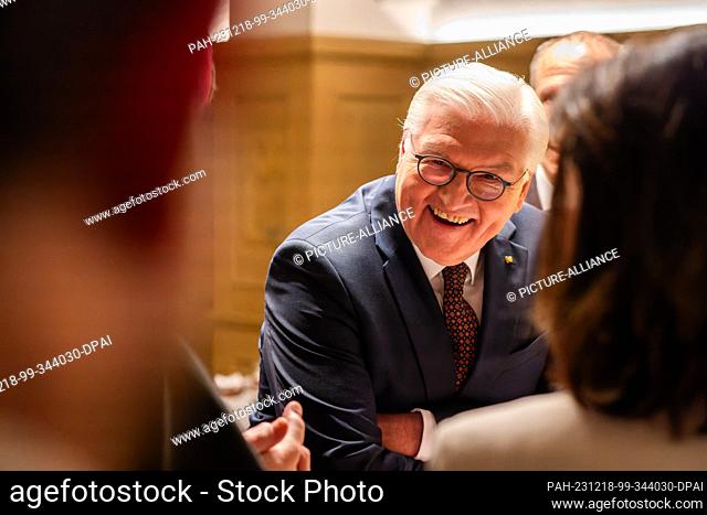 18 December 2023, Baden-Württemberg, St. Peter: Federal President Frank-Walter Steinmeier (SPD) talks to some guests of honor after a TV recording in the parish...