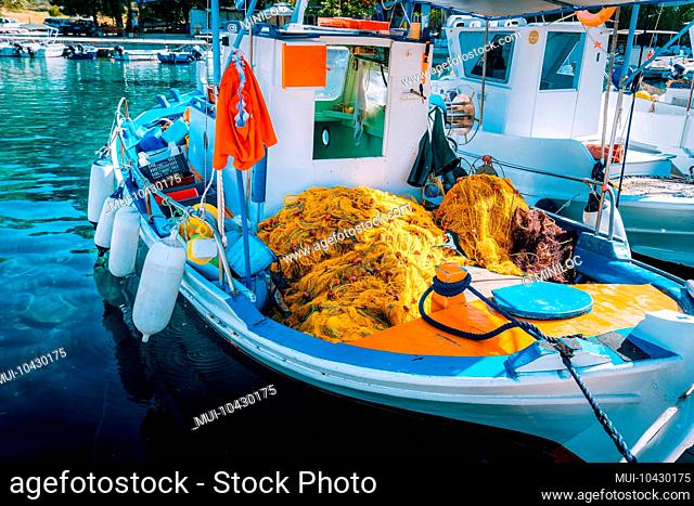 Traditional colorful fishing boat in the sea, Greece. Sunny summer day