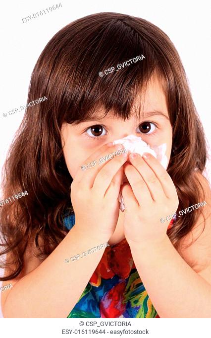 Little girl wiping nose with tissue