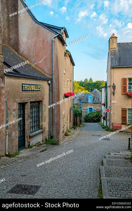Rochefort-en-Terre, Morbihan / France - 24 August, 2019: narrow alley in the historic old town of Rochefort-en-Terre in Brittany