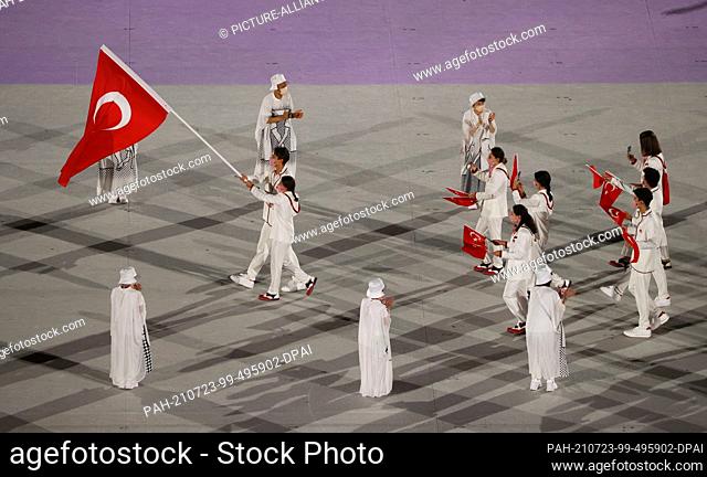 23 July 2021, Japan, Tokio: Olympics: Opening ceremony at the Olympic Stadium. The team from Turkey with the flag bearers swimmer Tuncel Merve and swimmer Saka...