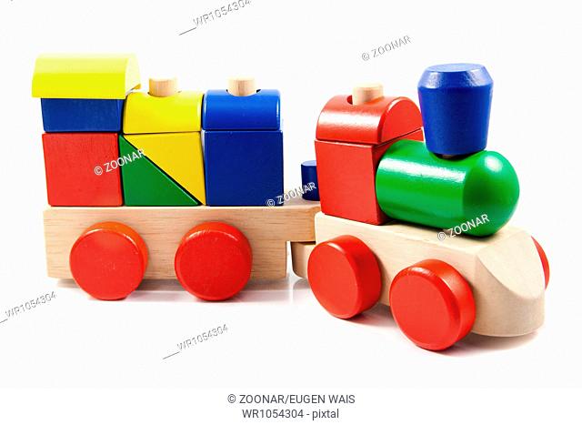 Colorful wooden toy train isolated on white backgr