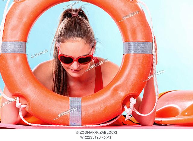 Woman in sunglasses with ring buoy lifebuoy