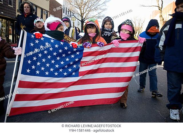 Paraders march in the annual Three Kings Day Parade in the Bushwick neighborhood of Brooklyn. School children marched with camels and kings in their celebration...