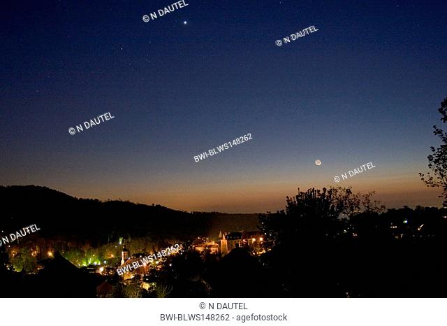 Moon and Venus in the evening sky over the town, Germany, Baden-Wuerttemberg, Baden-Baden