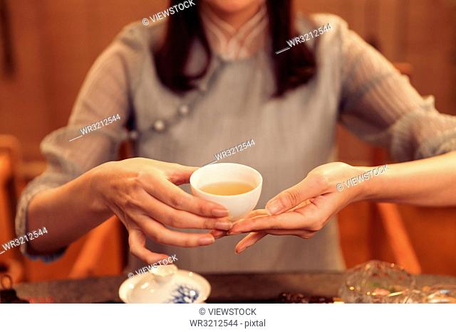 Young women show tea art