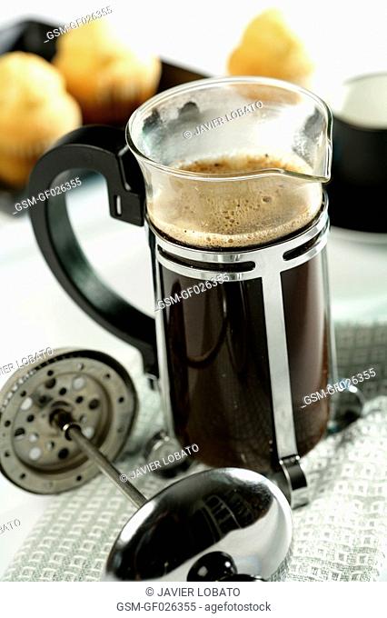 French press coffee maker with ground coffee inside