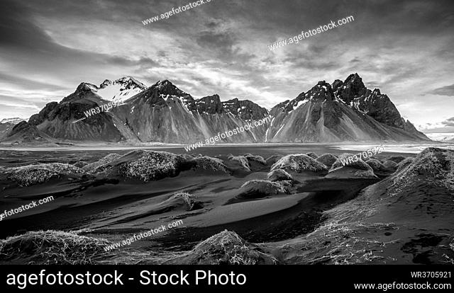 Black and white image of Icelandic Landscape Southern Iceland, Hofn, Stokksnes peninsula with the famous Vestrahorn Mountains and dramatic sky