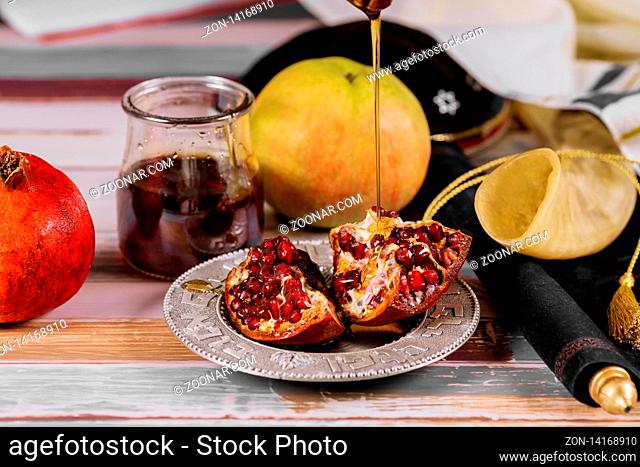 Apples, pomegranate and honey for Rosh Hashanah jewish holiday torah book, kippah a yamolka talit