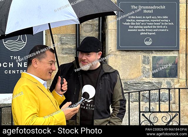 26 August 2023, Great Britain, Drumnadrochit: Paul Nixon (l) of the Loch Ness Centre and project manager Alan McKenna stand outside the Loch Ness Centre tourist...