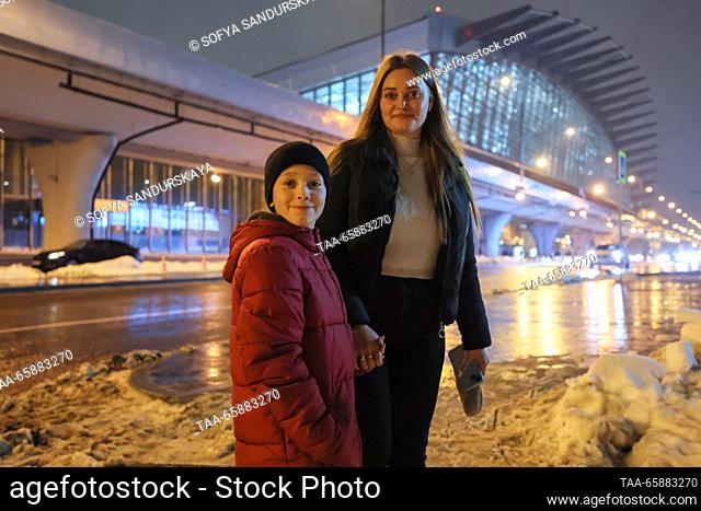 RUSSIA, MOSCOW - DECEMBER 19, 2023: Alexandra Zhulina and her son who has arrived on an Istanbul-Moscow flight, are seen at Vnukovo International Airport