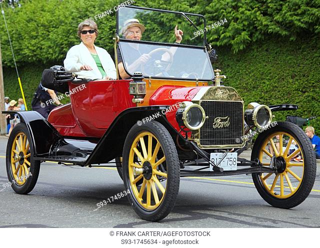 A antique Ford model T convertible in a parade for the Comox Aquatic Days festival