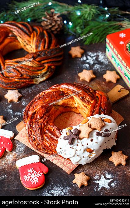 Sweet Bread Wreath decorated with stars cookies. Honey brioche garland with chocolate and nuts. Holiday recipes. Braided Bread