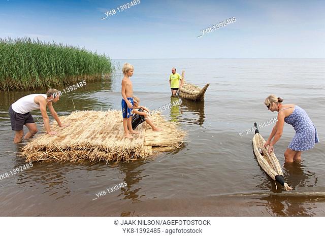 People on Reed Boat and Reed Mat, Lake Peipsi, Estonia, Europe