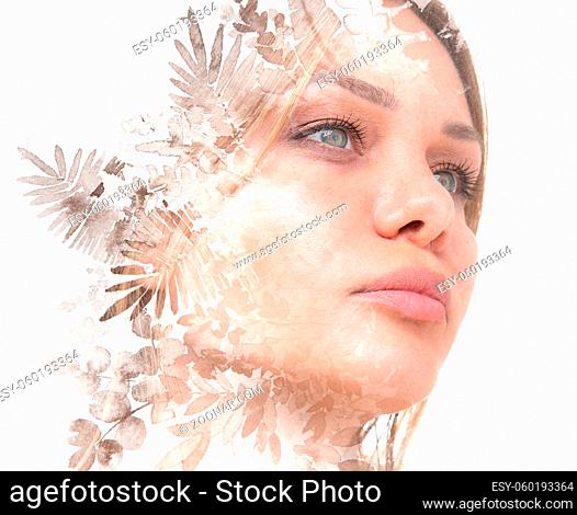 A double exposure portrait of a woman with see-through leaves