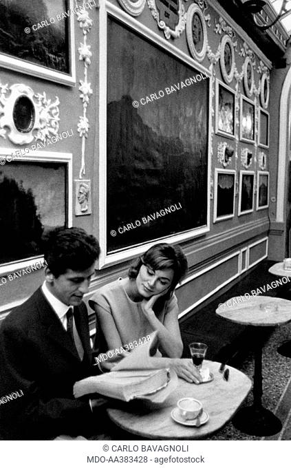 Giulio Bosetti and Lydia Alfonsi at the Antico Caffè Greco in Rome. Italian actor Giulio Bosetti consulting a book with Italian actress Lydia Alfonsi (Lidia...