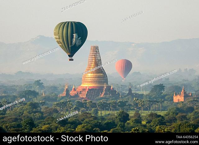 MYANMAR, BAGAN - OCTOBER 29, 2023: Balloons are seen over a Buddhist temple complex at sunrise. Yuri Smityuk/TASS