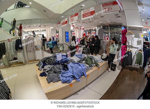 New York NY/USA-December 26, 2018 Shoppers search for bargains in the Gap store store on Fifth Avenue in New York on Wednesday, December 26, 2018