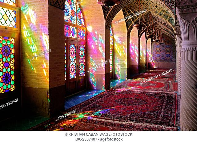 Inside the winter prayer hall of Nazir-al Molk Mosque (Masjed-e Nazir-al-Molk) with the morning sun sending colorful rays through the stained glass, Shiraz