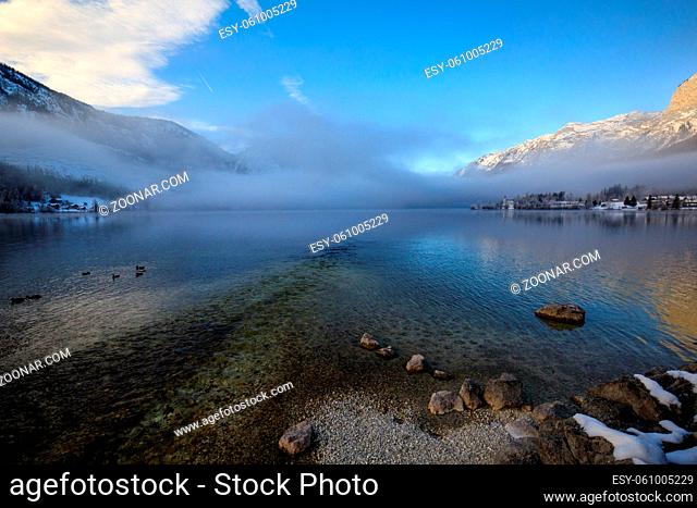 Winter landscape with lake and reflection during the sunrise at Grundlsee in Austria