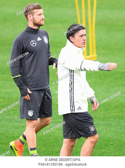 Germany's head coach Joachim Loew (R) and Shkodran Mustafi during a training session of the German national soccer team on the training pitch next to team hotel...