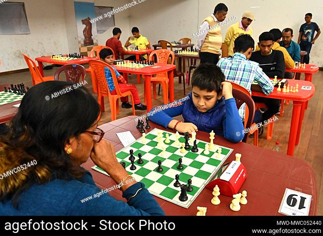 Shikha Das Gupta, a 65-year-old lady plays chess during a state level BLITZ CHESS CONTEST at the state chess coaching centre hall at Agartala