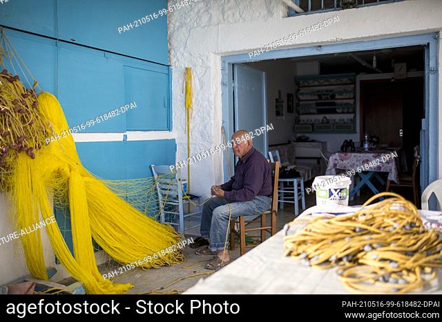 13 May 2021, Greece, Klima: Nikos, 83, repairs fishing nets. On the island of Milos, for example, and other Greek islets