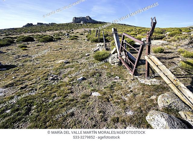 Fence at Sierra Paramera and Graja cliff on the background. Avila. Spain. Europe