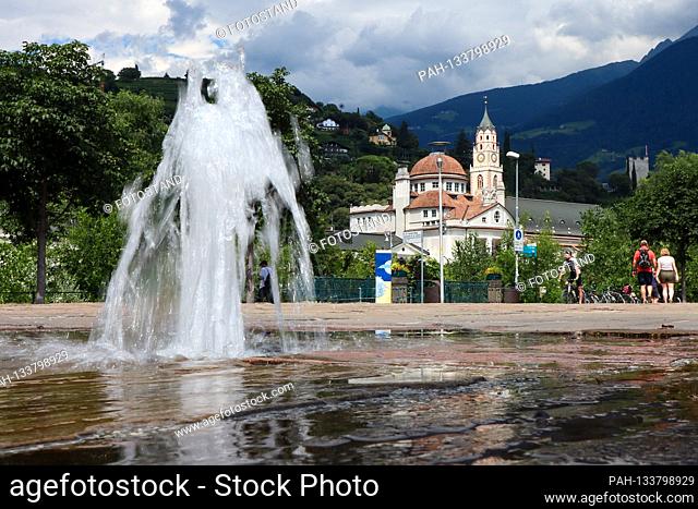 South Tyrol, Italy July 2020: Impressions of South Tyrol July 2020 Merano, spa town, view from the thermal spa with fountains to the spa house and parish church...