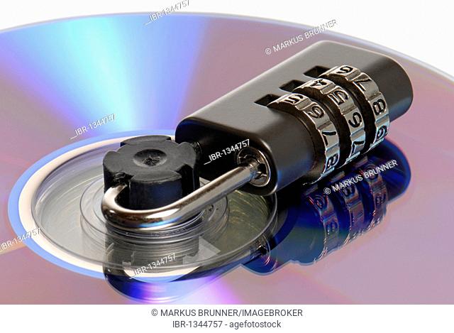 Combination lock on a CD spindle, symbolic image for data protection