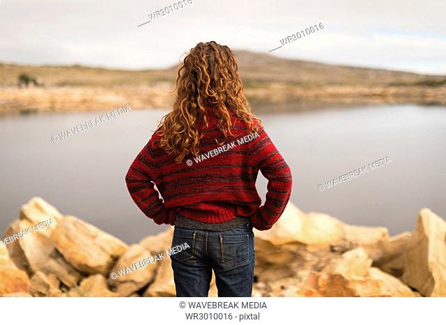 Woman standing near lakeside