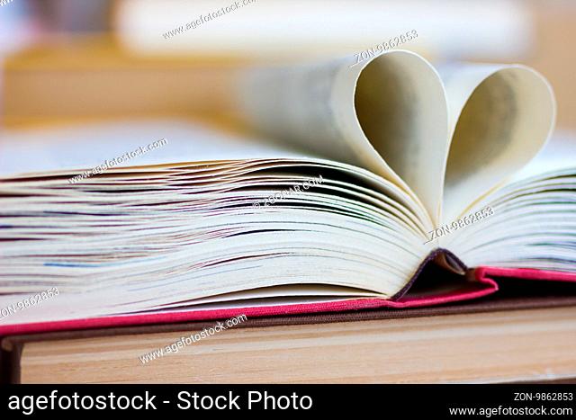 Opened book with heart shaped pages